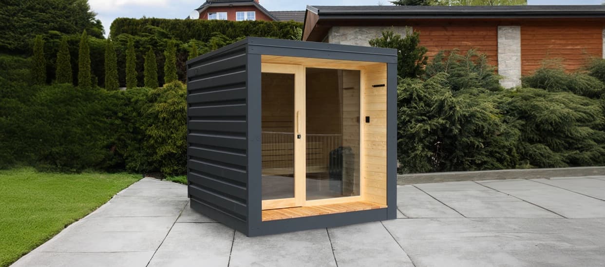 Maata panoramic sauna in a garden – anthracite shell with front glazing