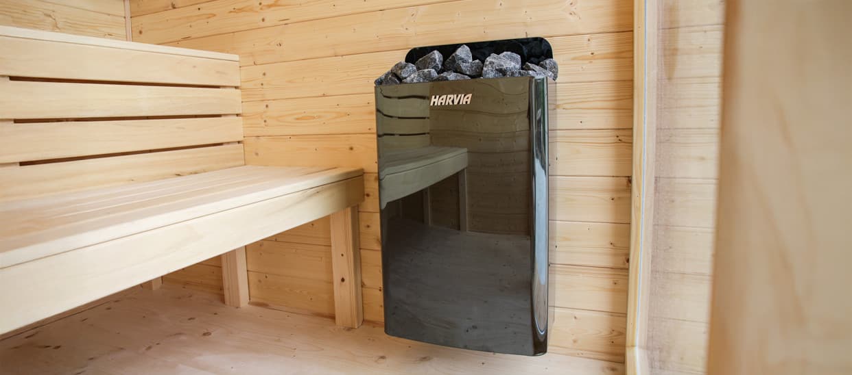 Harvia Cilindro heater with stones inside a TIKKA sauna